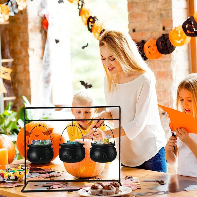 Woman and children decorating pumpkins with Halloween decorations in a festive setting.